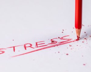 the word "stress" written on a piece of paper
