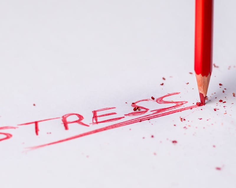the word "stress" written on a piece of paper